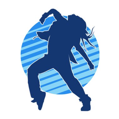 Modern dansçı pozunun silueti. Hip hop dansı yapan genç bir kızın silueti.