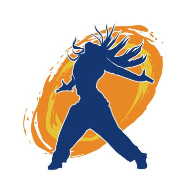 Modern dansçı pozunun silueti. Hip hop dansı yapan genç bir kızın silueti.