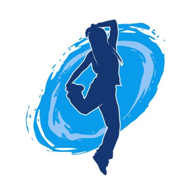 Modern dansçı pozunun silueti. Hip hop dansı yapan genç bir kızın silueti.