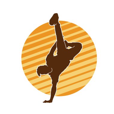 Poz veren bir erkek dansçının silueti. Dans eden bir adamın silueti.