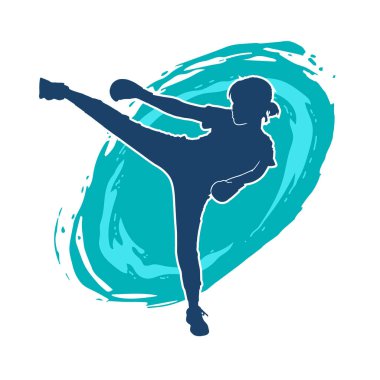 Dövüş sanatları tekmesi pozu veren bir kadının silueti. Dövüş sanatlarındaki bir kadının silueti tekme atma pozu veriyor..