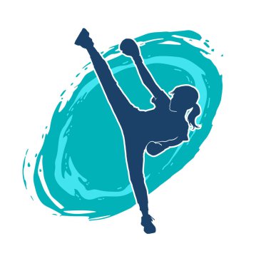 Dövüş sanatları tekmesi pozu veren bir kadının silueti. Dövüş sanatlarındaki bir kadının silueti tekme atma pozu veriyor..