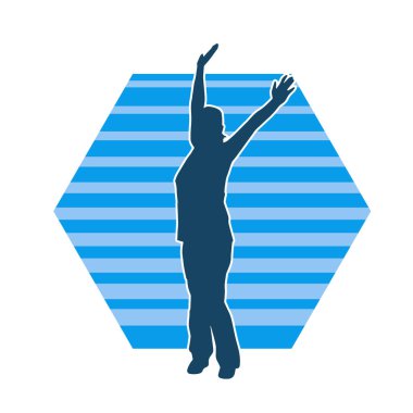 Kollarını kaldıran kadın silueti. Bir kadının silueti ellerini kaldırıyor..