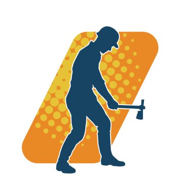 Hareket halindeki bir işçinin silueti, baltasını kullanarak poz verir..