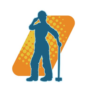 Çalışan bir işçinin silueti balyoz aletini kullanarak hareket halinde poz verir.