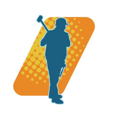 Çalışan bir işçinin silueti balyoz aletini kullanarak hareket halinde poz verir.