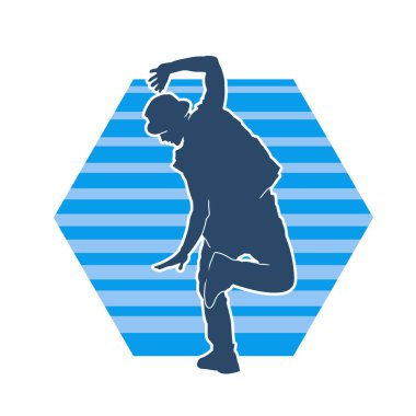 Dans eden bir adamın silueti. Erkek dansçının silueti poz veriyor..