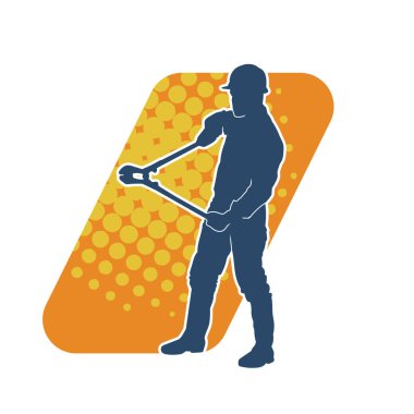 Bir erkek işçinin silueti hareket halindeyken büyük bir kerpeten ya da cıvata kesici aletle poz verir