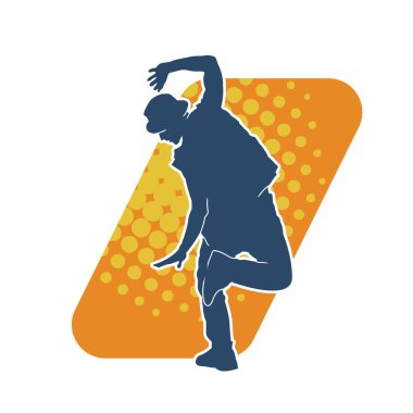 Dans eden bir adamın silueti. Erkek dansçının silueti poz veriyor..