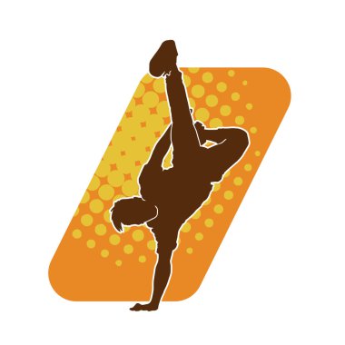 Poz veren bir erkek dansçının silueti. Dans eden bir adamın silueti.