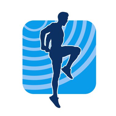 Spor yapan, fiziksel egzersiz yapan ya da pilates yapan bir adamın silüeti.