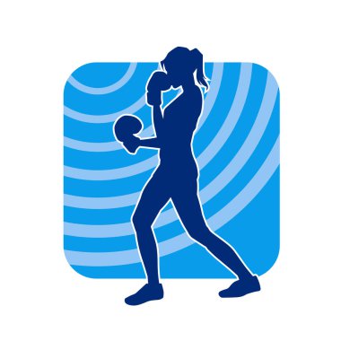 Kadın boks oyuncusunun silueti. Boks yaparken boks eldiveni giyen bir kadının silueti..