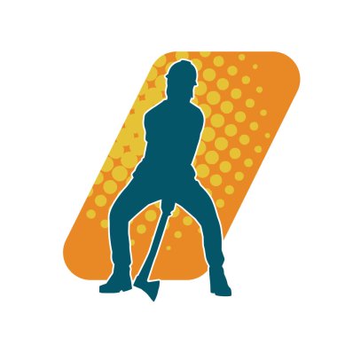 Hareket halindeki bir işçinin silueti, baltasını kullanarak poz verir..