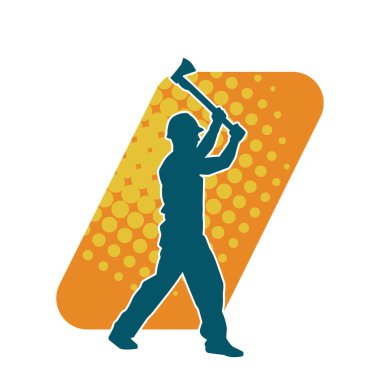 Hareket halindeki bir işçinin silueti, baltasını kullanarak poz verir..