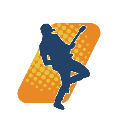 Elektro gitar çalan bir müzisyenin silueti. Bir erkek gitaristin silueti.