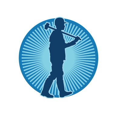 Çalışan bir işçinin silueti balyoz aletini kullanarak hareket halinde poz verir.