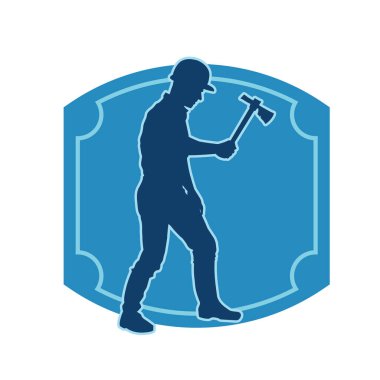 Hareket halindeki bir işçinin silueti, baltasını kullanarak poz verir..