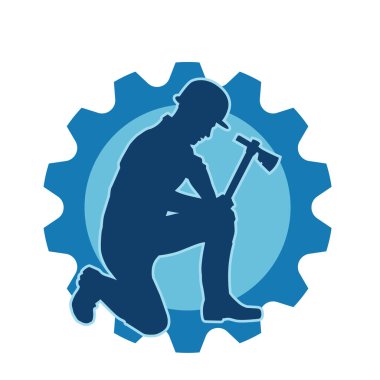 Hareket halindeki bir işçinin silueti, baltasını kullanarak poz verir..