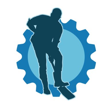 Bir erkek işçinin silüeti bir kürek aletiyle toprağı kazıyor..