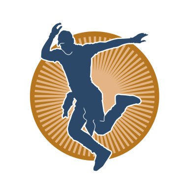 Hareket halindeki bir erkek dansçının silueti. Dans eden zayıf bir adamın silueti..