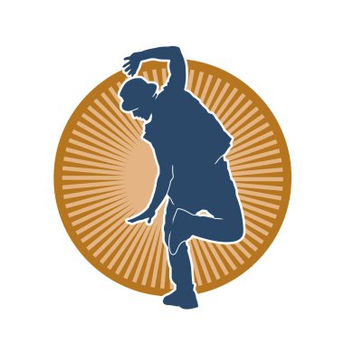 Hareket halindeki bir erkek dansçının silueti. Dans eden zayıf bir adamın silueti..