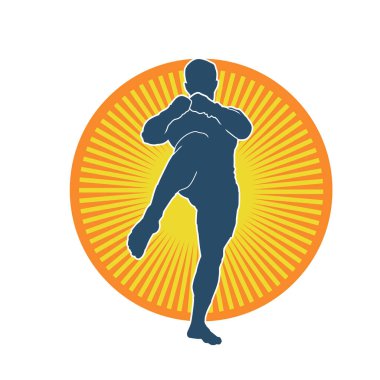 Hareketli erkek kickboksör atletinin silueti. Tekme atan bir adamın silueti..
