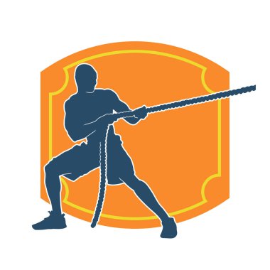 Sportif bir adamın silueti savaş halatıyla egzersiz yapıyor. 