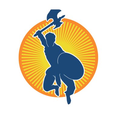 Muharebe halindeki bir savaşçının silueti savaş baltası ve demir kalkanla poz verir.