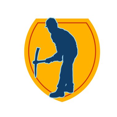 Görev sırasında baltayla dolaşan işçi kostümlü bir adamın silüeti. Bir madencinin hareket halindeki silueti balta aracı ile poz verir.