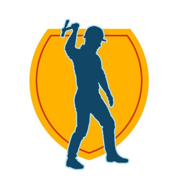 Hareket halindeki bir işçinin silueti, baltasını kullanarak poz verir..