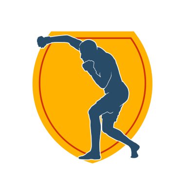 Erkek boks atletinin silueti iş başında. Boks sporu için eldiven giyen kaslı bir adamın silueti..