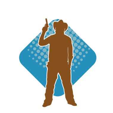 Bir kovboyun silueti tabancasını taşıyor. Atış pozisyonunda kovboy kostümü giyen bir adamın silueti..