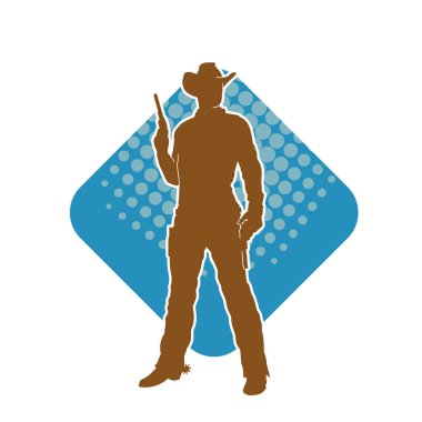 Bir kovboyun silueti tabancasını taşıyor. Atış pozisyonunda kovboy kostümü giyen bir adamın silueti..