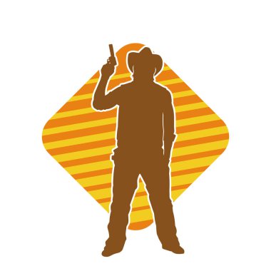 Bir kovboyun silueti tabancasını taşıyor. Atış pozisyonunda kovboy kostümü giyen bir adamın silueti..