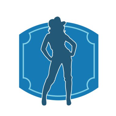 Kovboy kostümü giymiş bir kadın modelin silueti. Poz vermiş bir kovboy kızın silueti..