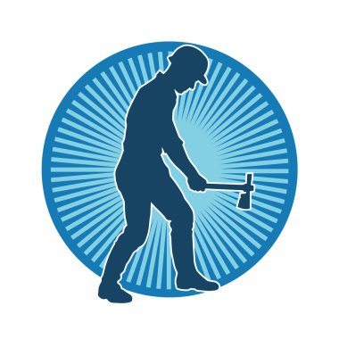 Hareket halindeki bir işçinin silueti, baltasını kullanarak poz verir..