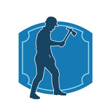 Hareket halindeki bir işçinin silueti, baltasını kullanarak poz verir..