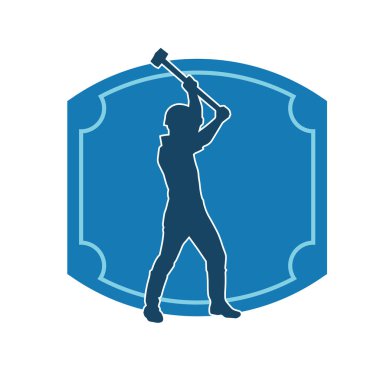 Çalışan bir işçinin silueti balyoz aletini kullanarak hareket halinde poz verir.