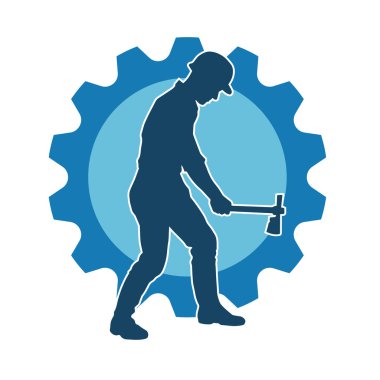 Hareket halindeki bir işçinin silueti, baltasını kullanarak poz verir..