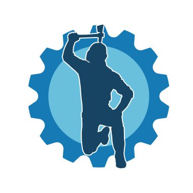 Hareket halindeki bir işçinin silueti, baltasını kullanarak poz verir..