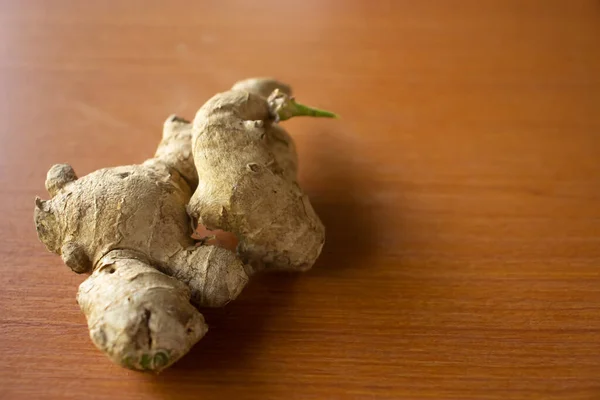 Ginger herbal plant. placed on a brown table