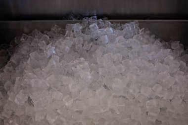 Pile of ice cubes in the metal sink