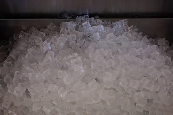 Pile of ice cubes in the metal sink