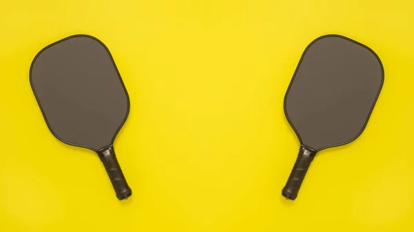 View Two Pickleball Paddles Bright Yellow Background Banner Poster Copy — Stock Photo, Image