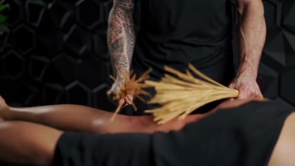 Cellulite Massage Professional Masseur Uses Bamboo Sticks Massage — Stock Video