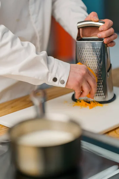 Chef Rubs Hard Cheese Metal Grater Cheese Crumbles Smoothly Cutting — Stock Photo, Image