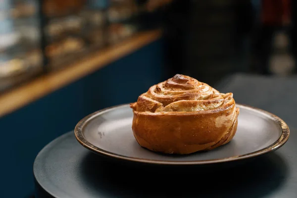 stock image Close-up, bakery - delicious bun with jam on rotating surface