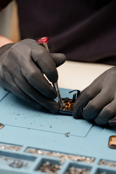 Macro shot - smart watch being repaired by an engineer