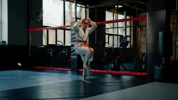 Girl Practices Karate Gym Woman Kimono Practices Movements Poses Martial — Stock Video