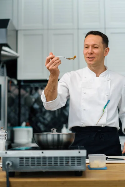 stock image professional emotional kitchen chef tastes freshly prepared dish breakfast healthy food concept